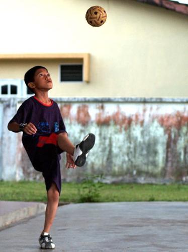 Sepak Takraw - Sepak Takraw (Kick Volleyball, or just Takraw for short) is a sport native to Southeast Asia, resembling volleyball, except that it uses a rattan ball and only allows players to use their feet and head to touch the ball. A cross between soccer and volleyball, it is a popular sport in Thailand, Cambodia, Malaysia, Laos and Indonesia.