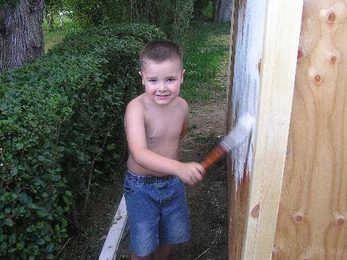 Jr painting the shed - Grandson Jr helping out by painting the shed