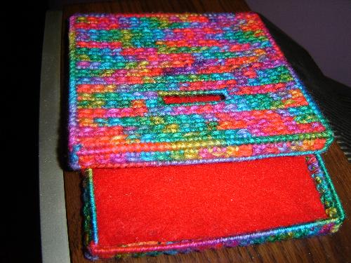 CD Case/holder - Made this holder with plastic canvas, 7 mesh and yarn. Keeps my cd's protected.