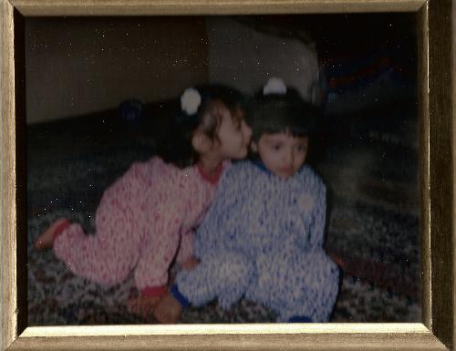 Avoiding a kiss? - LOL  I still vaguely remember that day xD we had just had speghatti for dinner (you might notice it around my lips, the blue one!) I remember my twiny came up to me wanting to give me a kiss but I reluctantly moved away from her xD rofl, poor girl.. I still do that to her XD