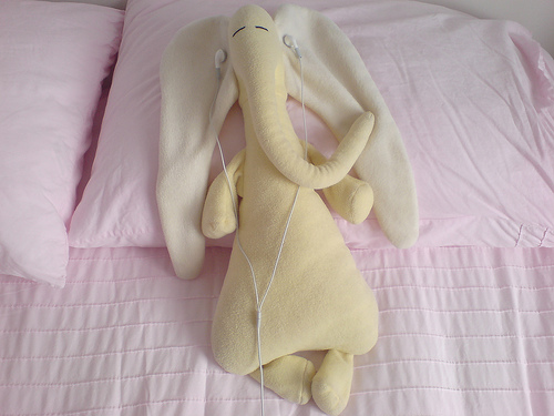 Elephunk - A cute elephant stuff toy listening to music through an iPod.