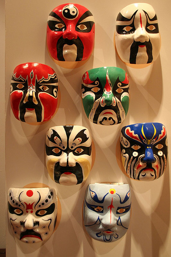 Masks depicting various characters and styles of c - at the chinese section of Asian Civlisations Museum