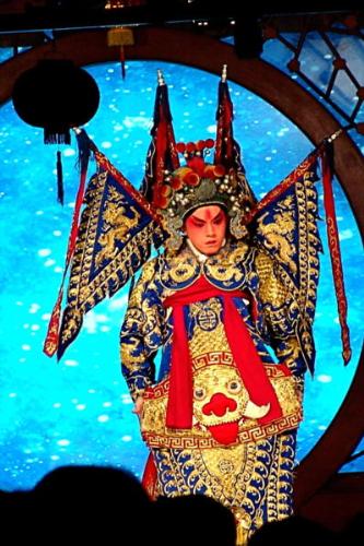 A male performer - he is performing.