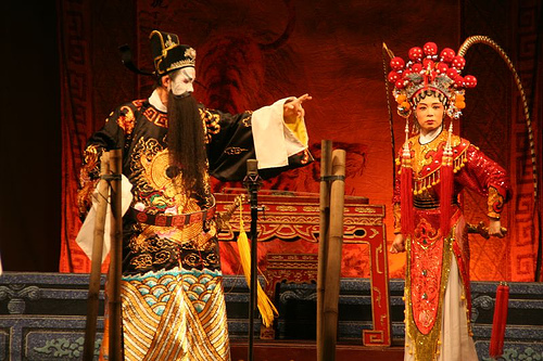 opera performance  - they are acting through their comportment,face-look,voice to told us a story.