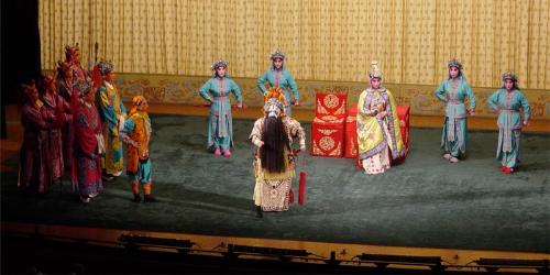 Opera production - Ensemble cast in classical make-up and costume.