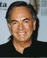 neil Diamond - Age is lookin oh so good on this song bird of poems that he calls only lyrics. A book of poems could be compiled and he could make another fortune. Yet who needs another fortune. He gets his contentment from writing on long yellow legal pads. He stacks them high in corners of his studio where he writes. 