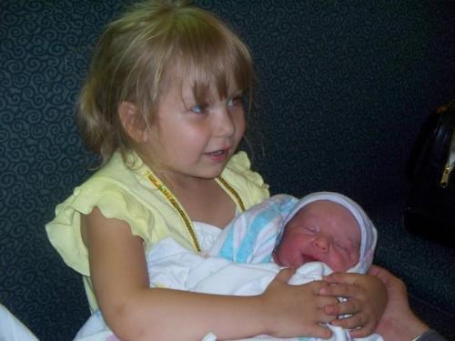 My kids - My oldest daughter, Pamela holding her newborn brother, Shane.