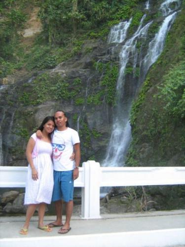 tamaraw falls - this is a picture of my husband and i during our trip to mindoro. we passed by tamaraw falls which is the tallest waterfall in mindoro. it is 131 meters above sea level and has a natural swimming pool at its base.