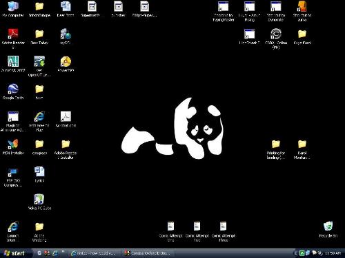 My desktop appearance as of 10-31-08 - I used enjoi's panda logo and inverted the colors. Had the background all black and I used Royal Noir for the Color scheme of XP's appearance