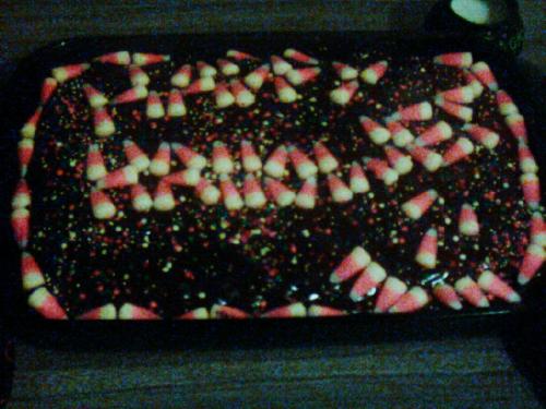 Halloween cake - A cake that is decorated with candy corn, spelling out happy halloween Halloween cake - A cake that is decorated with candy corn, spelling out happy halloween