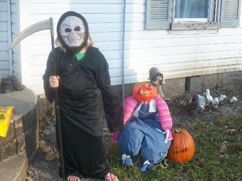 My daughter & her scarecrow - This is my daughter in her Halloween costume and the scarecrow I made using some of her old clothes. My daughter & her scarecrow - This is my daughter in her Halloween costume and the scarecrow I made using some of her old clothes.