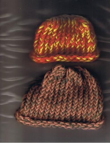 2 of my 6 baby hats that I'm going to donate - These first hats (I made 8 in all, but gave away two already), I made with my knifty knitter. They aren't perfict, but they'll keep some babies warm.