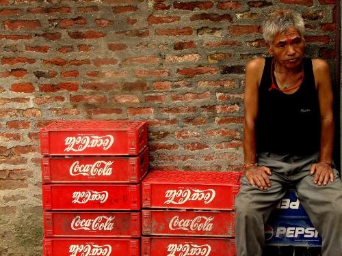 cola - a cola shop keeper with cola trays