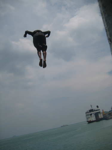 flying boy lol - this is a boy who was jumping from the top of the ship when i was on my vacation to my hometown in Sumatra, Indonesia. he earned money from this act, the passengers paid him to jump from the top of it. the higher the jump, the more money he can get. it may seems dangerous, but its how they live n they're having fun doin it=)