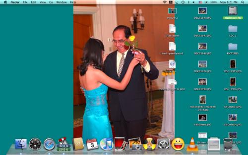 My Desktop - My currently'messy' desktop. Usually what you'll see aside from my wallpaper would be the MACINTOSH HD icon and my dock. I would be cleaning up my desktop and would be arranging my files before I do my backup tonight.   Sorry if the file's a little small or the resolution's not good, I resized it to be able to upload it here.