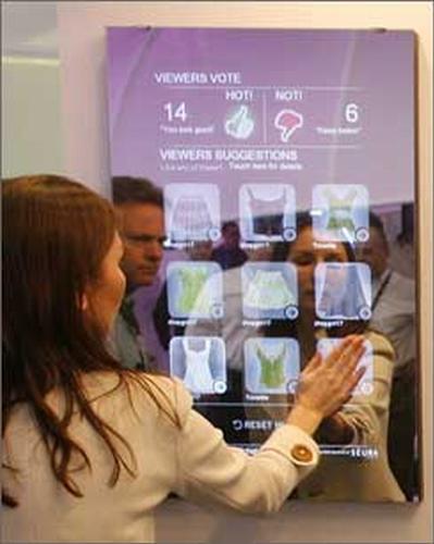Interactive Mirror - This shows a woman using an interactive mirror...