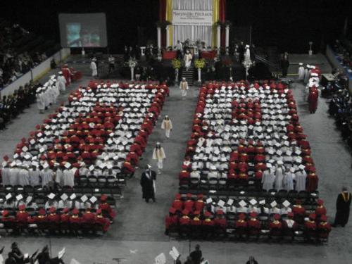 Graduation - MPHS graduation, girls had to wear white gowns, guys red. There's a few rows missing, but you can still see the 08.