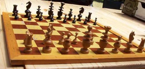 Chess - A board game for two players, each beginning with 16 pieces of six kinds that are moved according to individual rules, with the objective of checkmating the opposing king   - answers.com