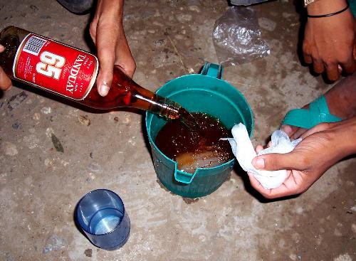 Tanduay 65 + Lime Softdrinks - One of the many locally made cocktails here in the Philippines. Its mixture consists of:  1 flask or long-necked bottle of Tanduay Rhum 1 550 ml bottle of any lime-flavored softdrink preferably Lift or Mountain Dew 1 liter of water  It's relatively cheap, costs less than PHP50 per set.