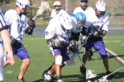 Lacrosse is the best sport - the one on the right is me( in the white and pourple)   i miss high school lax,  college lax is sooo mmuch more work and alot more serious.