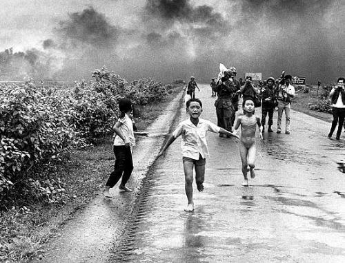Vietnam war - Vietnamese children flee from their homes. A South Vietnamese air force plane has accidentally dropped a napalm bomb on the village. This is without a doubt one of the most remembered images of the war. Twenty-five years later, the young girl running naked from her village, Phan Thi Kim Phuc, was named a UNESCO goodwill ambassador.