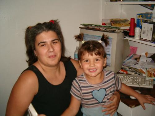 My daughter and I - This is a picture of my daughter and I. She wanted me to put my hair up in tails like her. So, I did.