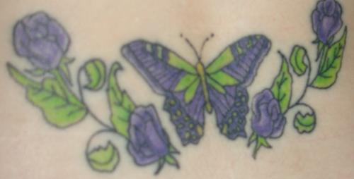 tattoo back butterfly - This was my third tattoo. The lady that did it was getting her license and apparently they have to do a certain number of tattoos with supervision to get it, so I of course stepped up, my last one cost $275 bucks. Butterflies are special to me, you can read why on my website www.jenboops.com and purple is my favorite color, so this is it. I must say thought that to me it looks kind of cartoony, especially compared to my others, so I would like to get it touched up, some shading and highlights. She did tell me though that the back tattoo has the biggest rate of passing out or throwing up, I just cried, lol.