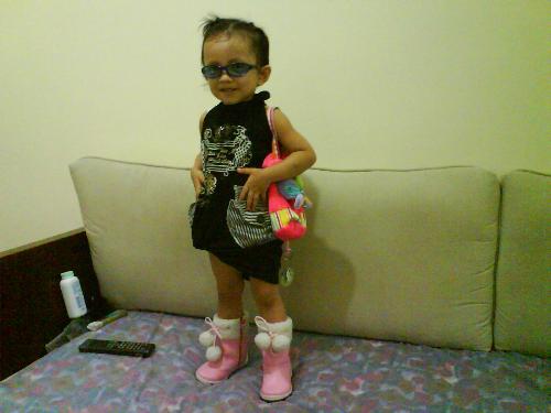 My daugther posing for the camera... - My daughter posing for the camera wearing her pink boots... and her cousins dress...