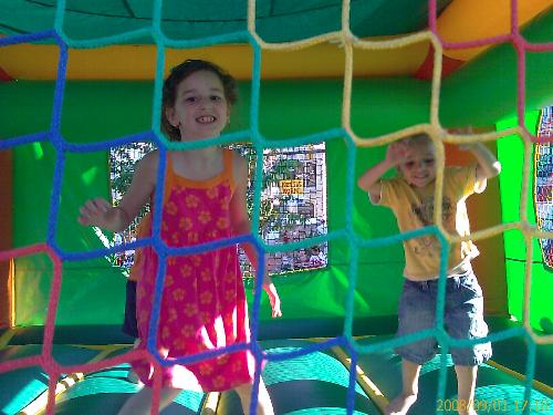My kids - We are at the Italain festival in the jumping thingy is my kids, having fun