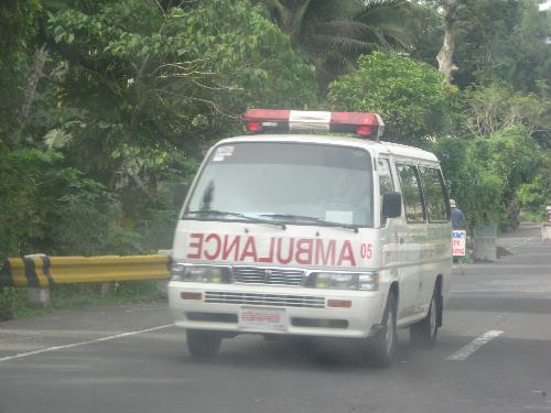 An Ambulance - A speeding ambulance on the street, with a dying patient inside.