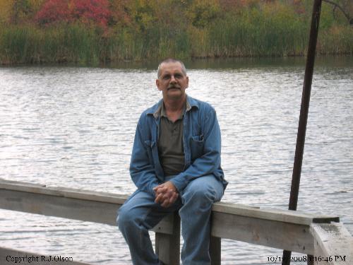Loving Natures Beauty - Sitting on a rail at a pond at a local nature center enjoying the fall day and colors of Minnesota.