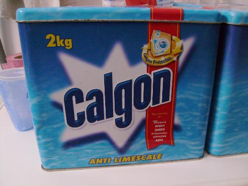 Calgon metal box - This is the product my mother uses on her washing machine to avoid calcareous development that damages the machine.