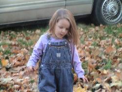 Brenna in her Tommy overalls - She just loves her 'farmer girl' overalls.  They are actually boy pants but she doesn't care.  A friend gave them to me after her nephew and then her daughter outgrew them.  I could never afford to buy Tommy Hilfiger for my kids so I took them.
