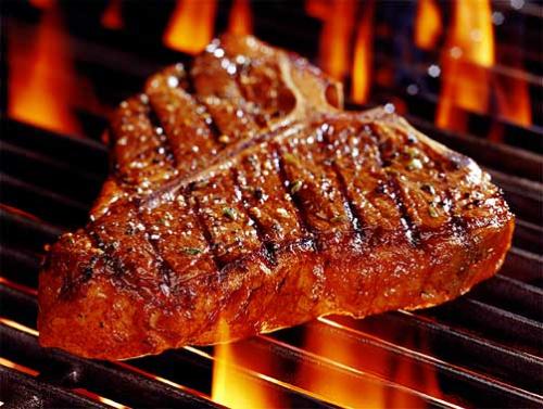 Grilled Steak - This is an image of an immaculately grilled Porterhouse steak just as I like it. Medium rare with the fat on it :)