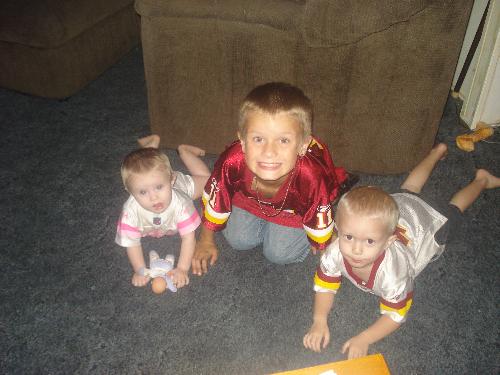 My little redskins fans =] - My 3 little munchkins wearing their redskins gear when we live in florida haha. Love it!!! Still gotta represent tho!! =]