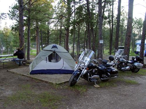 Motorcycles, trees, and tent - Motorcycles, trees, and tent This is the un-altered mystery photo.