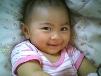 my youngest daughter at 6m - looking so cute in her smile