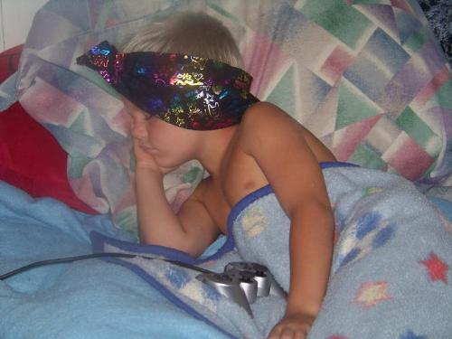 Skylar - This is Sky as he fell alseep in his room playing his playstation lol