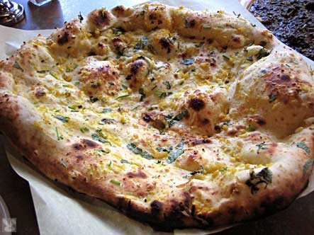naan - Garlic naan, one kind of Indian bread.