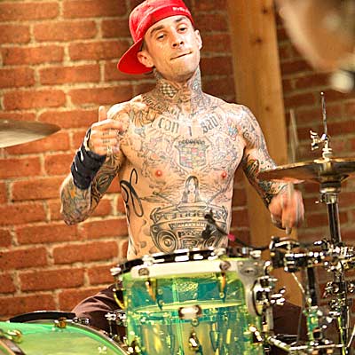Travis Barker - A snapshot of Travis Barker, the former drummer of a punk-rock group called Blink 182.