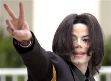 Michael Jackson - A snapshot of Michael Jackson raising the sign of peace.