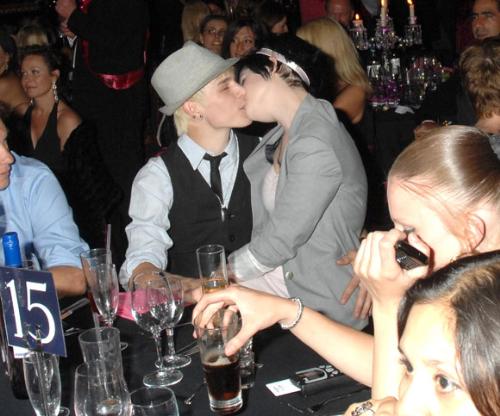 Kelly Osbourne and Luke Worrell - A snapshot of Kelly Osbourne and her 18 year old boyfriend Luke Worrell, kissing each other in a bar.