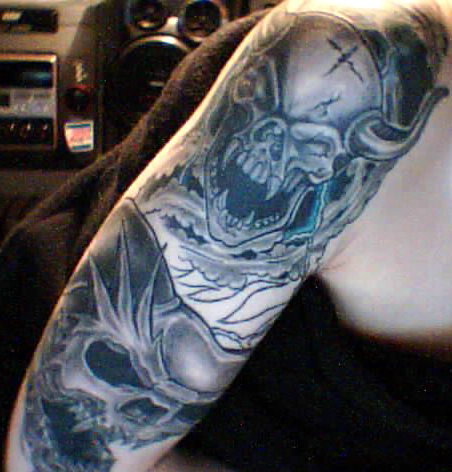 Tattoo - This is the work I've done so far on what will one day become a full sleeve. Done by Mike Manson at Ritualistics in Edmonton, Alberta, Canada.