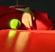 self portrait with an apple - I took this on the bus one day. Just loved the green color of the apple in contrast to the tacky red bus seats!