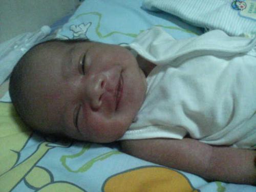 my baby smiles - this is my baby. he is almost three weeks old now.