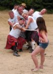 games - Tug of War played using a long object like wood etc.