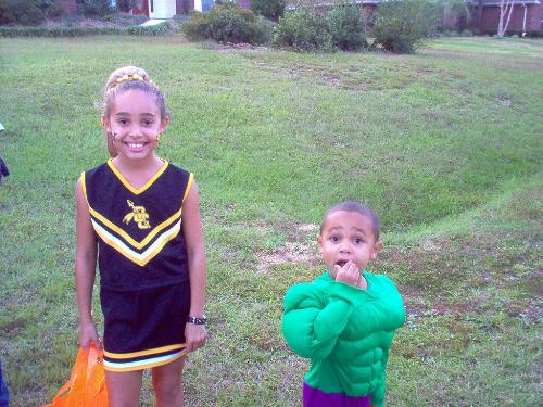 Cheerleaders and The Hulk - The kids trick or treating on Halloween.