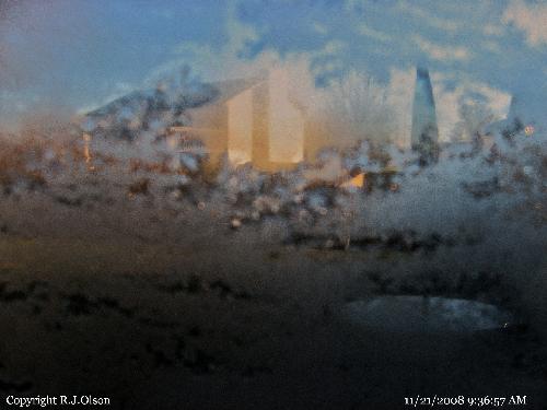 Ice crystals - Cool looking shot of ice crsytals and a house out back.