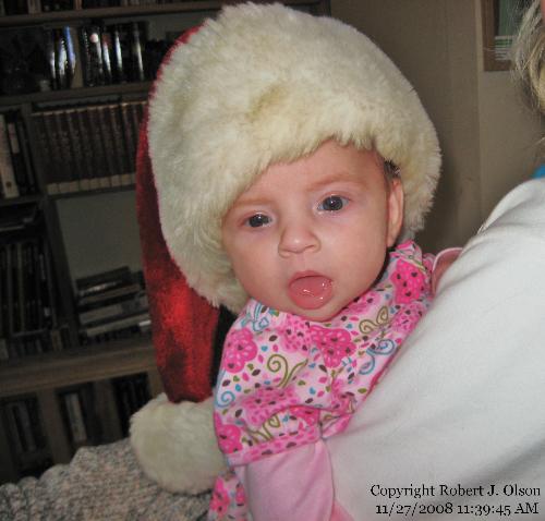 Santa Savanna - She loves her grandpas hat.