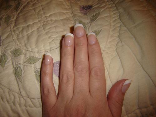Fake Fingernails - Here is my hand with fake Glue-On Fingernails. 
Medium Length French Manicure.

